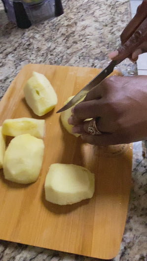 Eurceys' Flava Chopping board shown cutting fruits. 